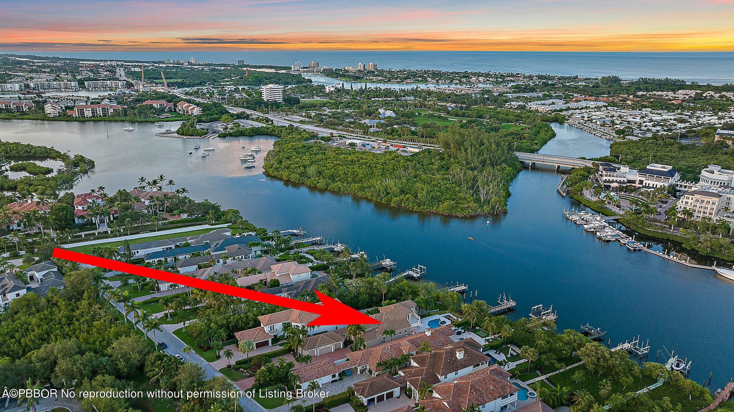 an aerial view of lake and houses with outdoor space