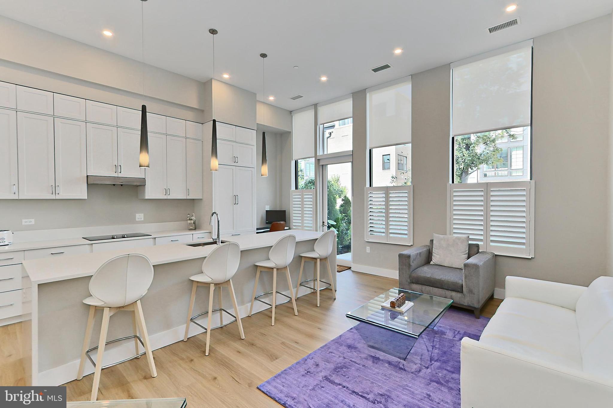 a living room with furniture wooden floor and a table