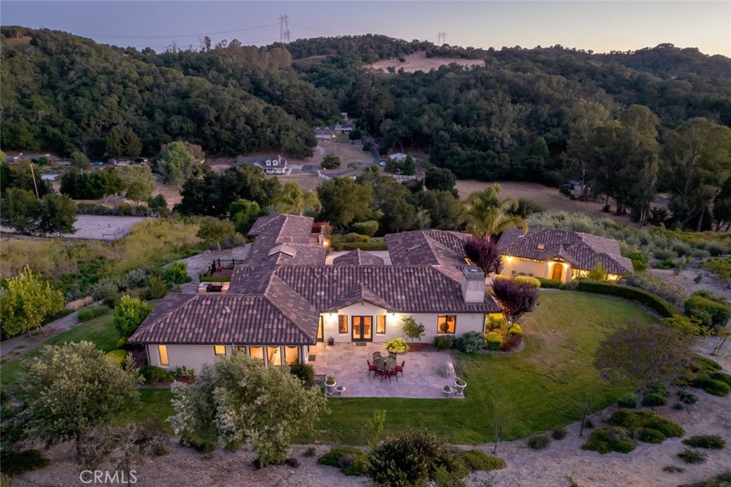 an aerial view of house with a garden