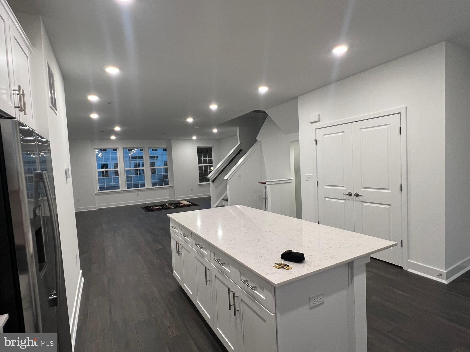 a kitchen with a sink a refrigerator and a sink