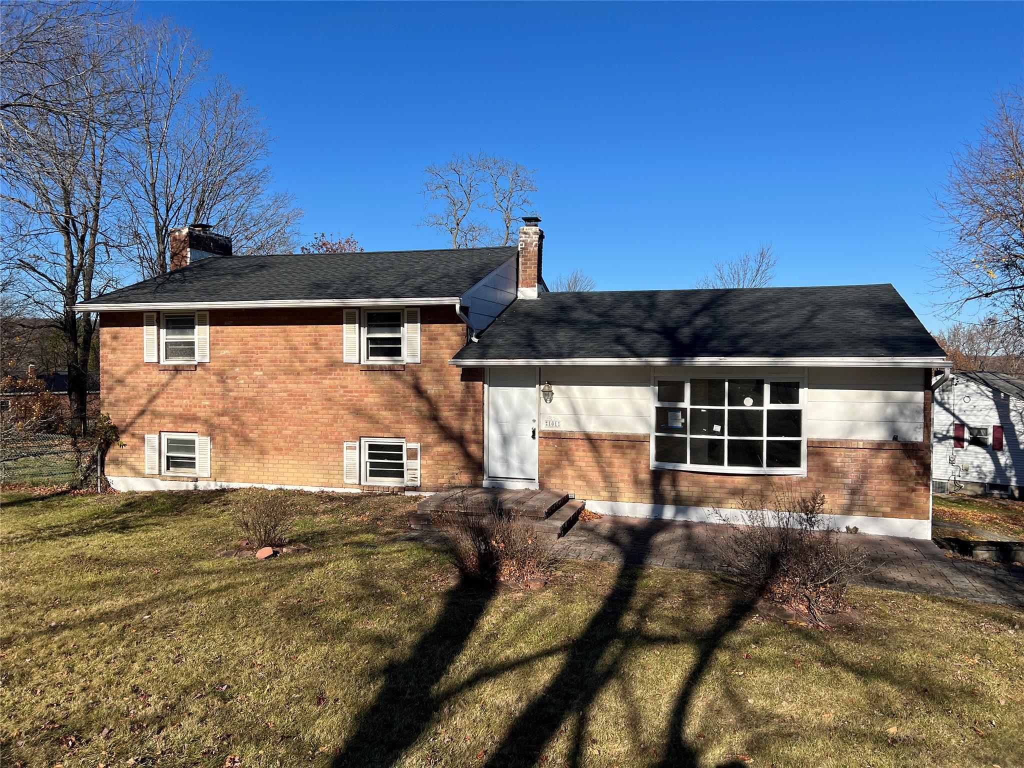 Front view of house with a yard