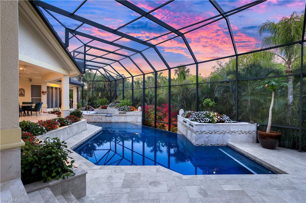 Welcome home to this absolute STUNNER in Hidden Harbor of Bonita Bay!