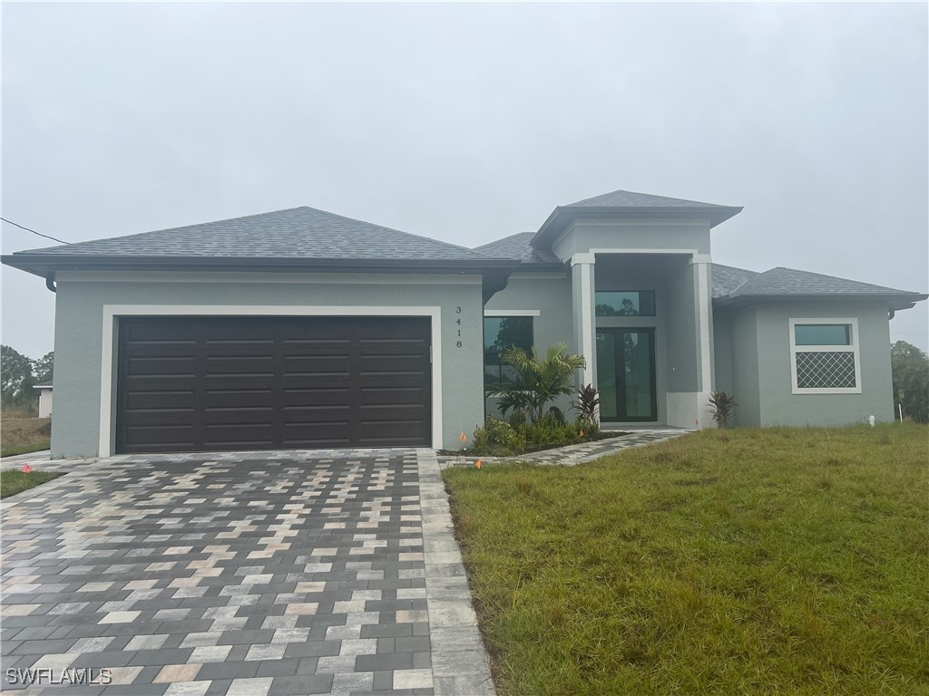 a front view of a house with a yard