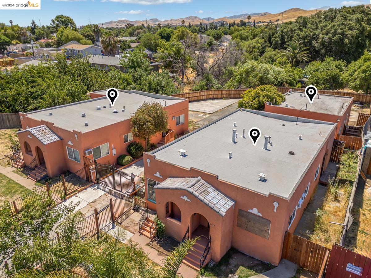 an aerial view of a house with a yard