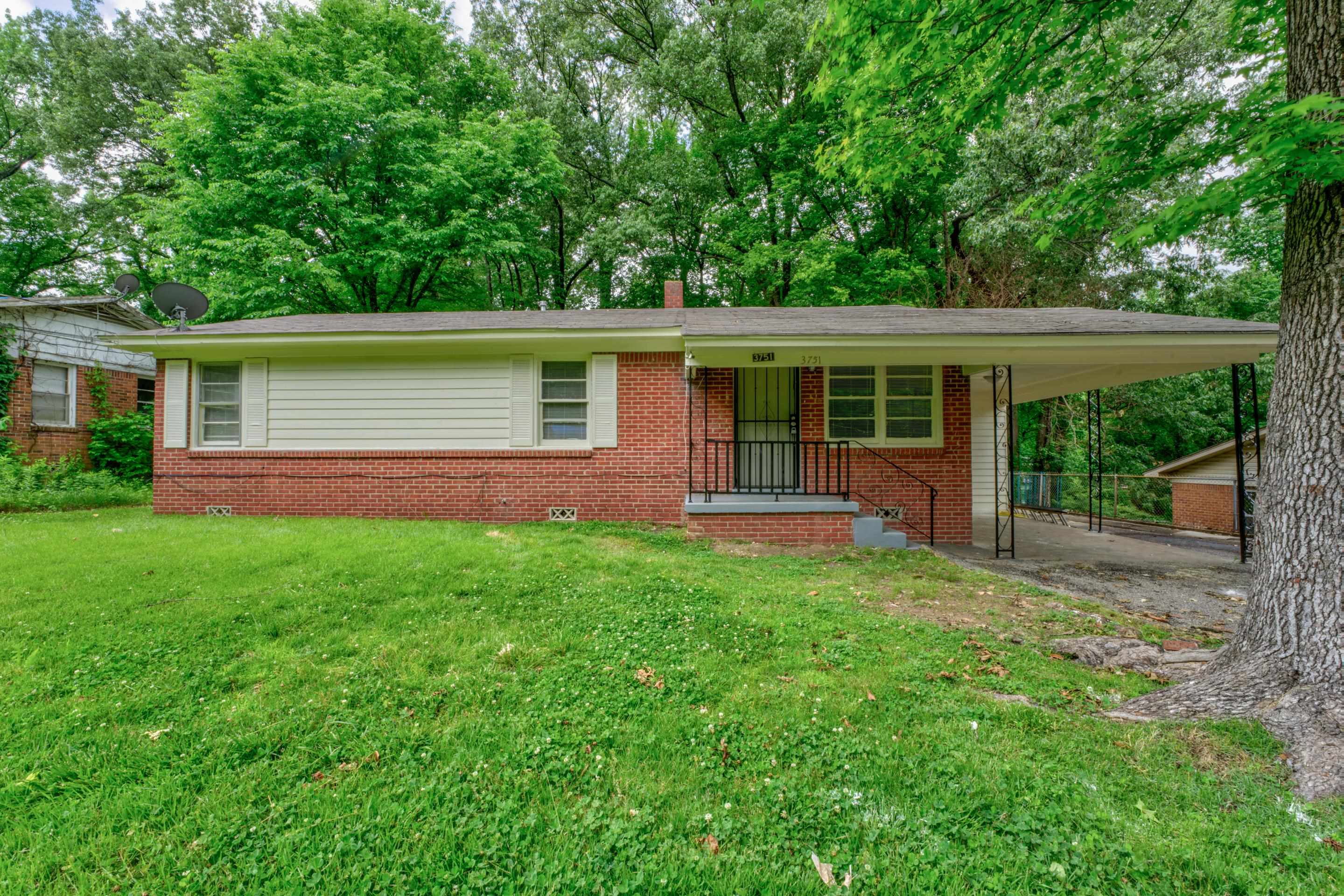 front view of a house with a yard