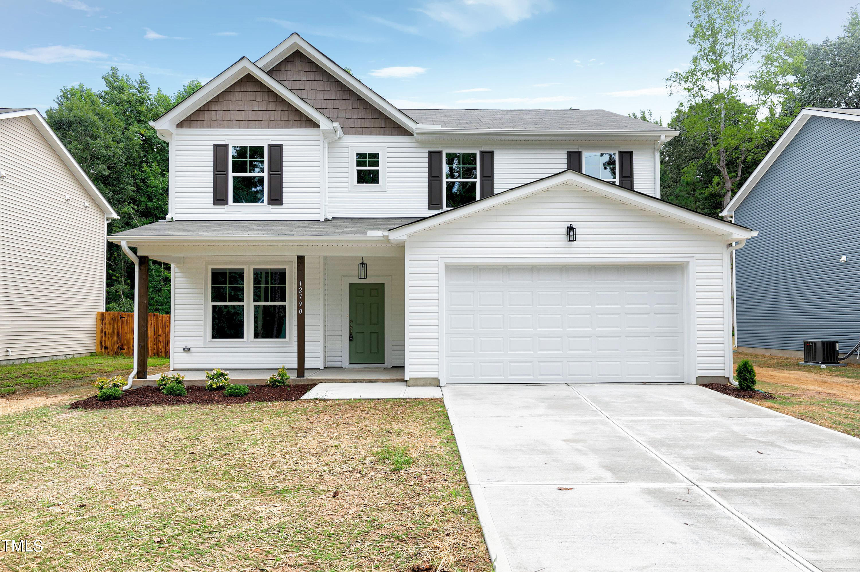 a front view of a house with yard