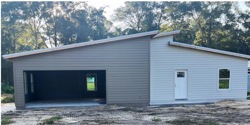 a view of a house with a garage