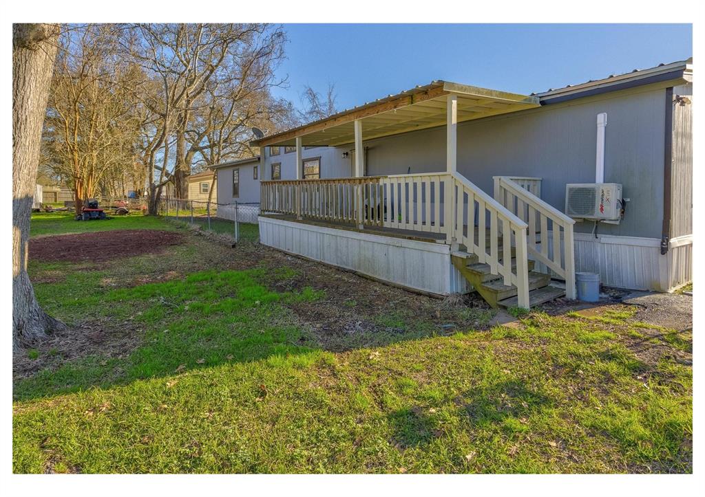 a view of backyard with small cabin