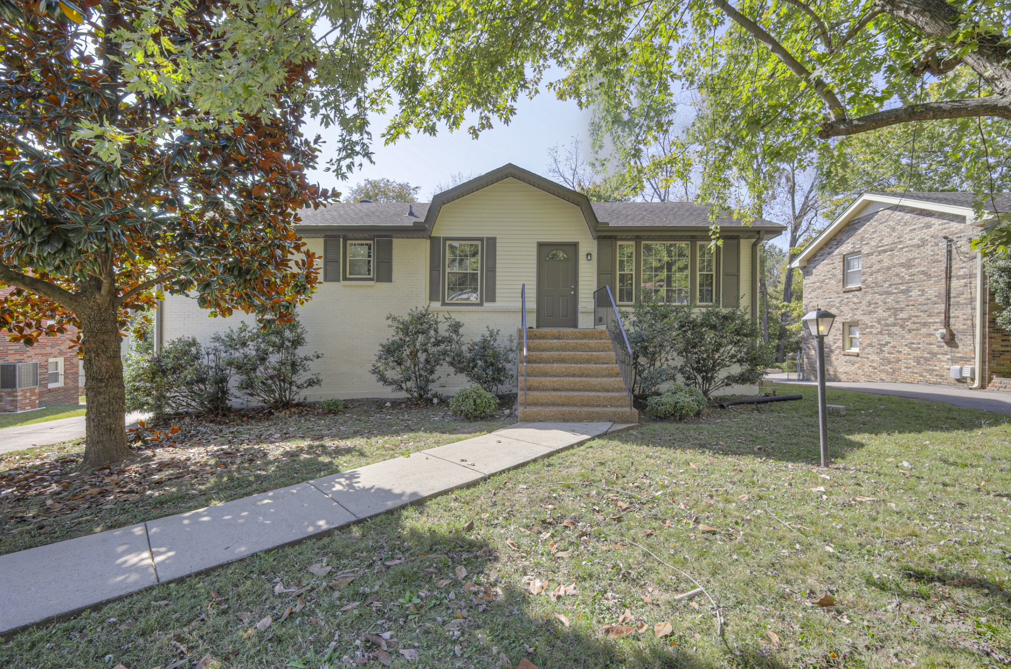 a front view of a house with garden