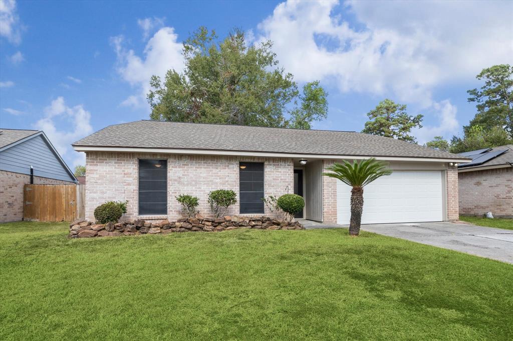 a front view of house with yard and outdoor seating