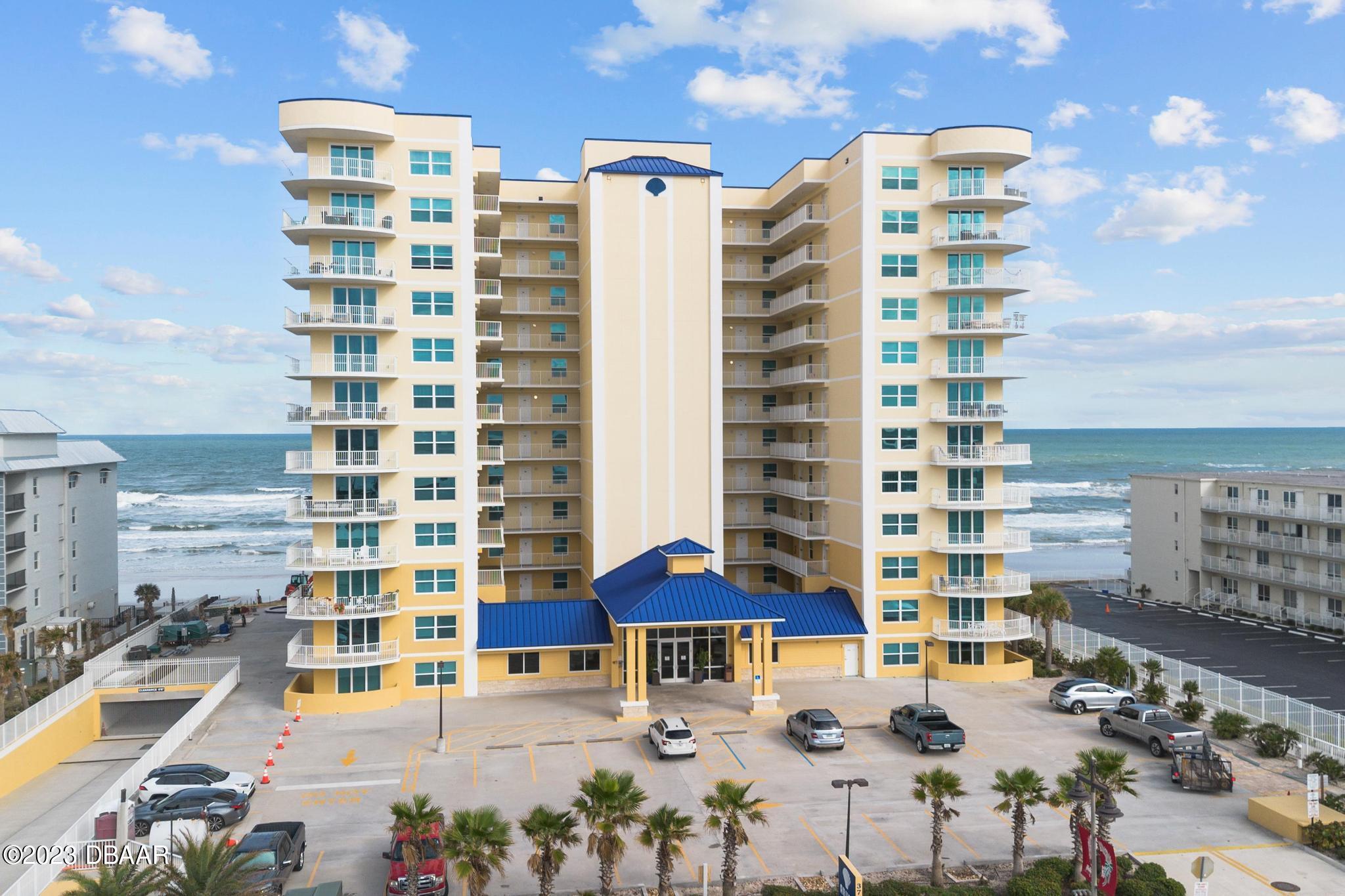 a building view with outdoor seating