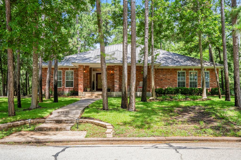 Beautiful low maintenance brick home on wooded golf course lot.