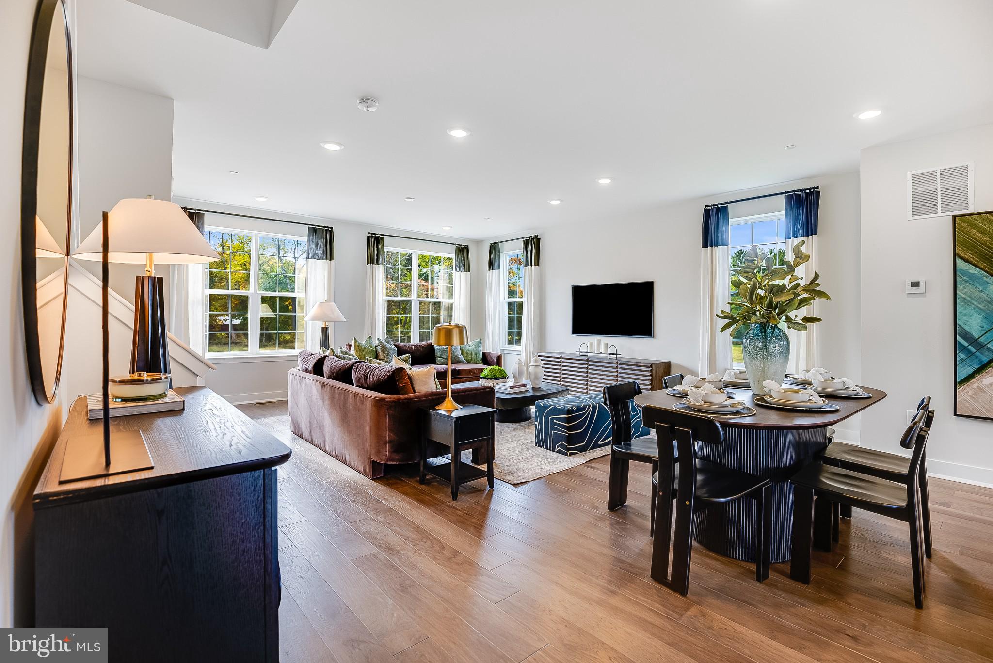 a living room with fireplace furniture and a flat screen tv