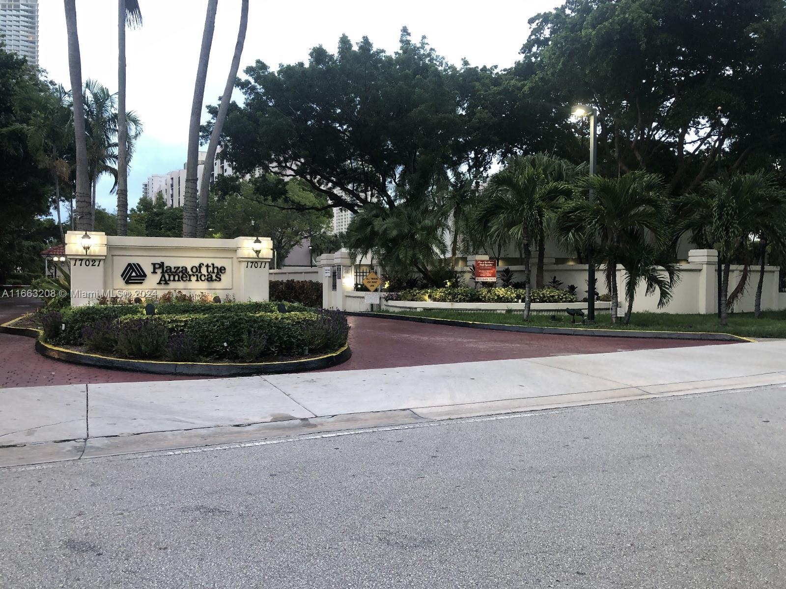 a view of street along with house and trees