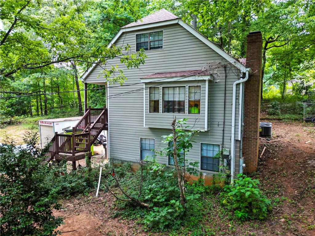 a view of an house with backyard space and sitting area