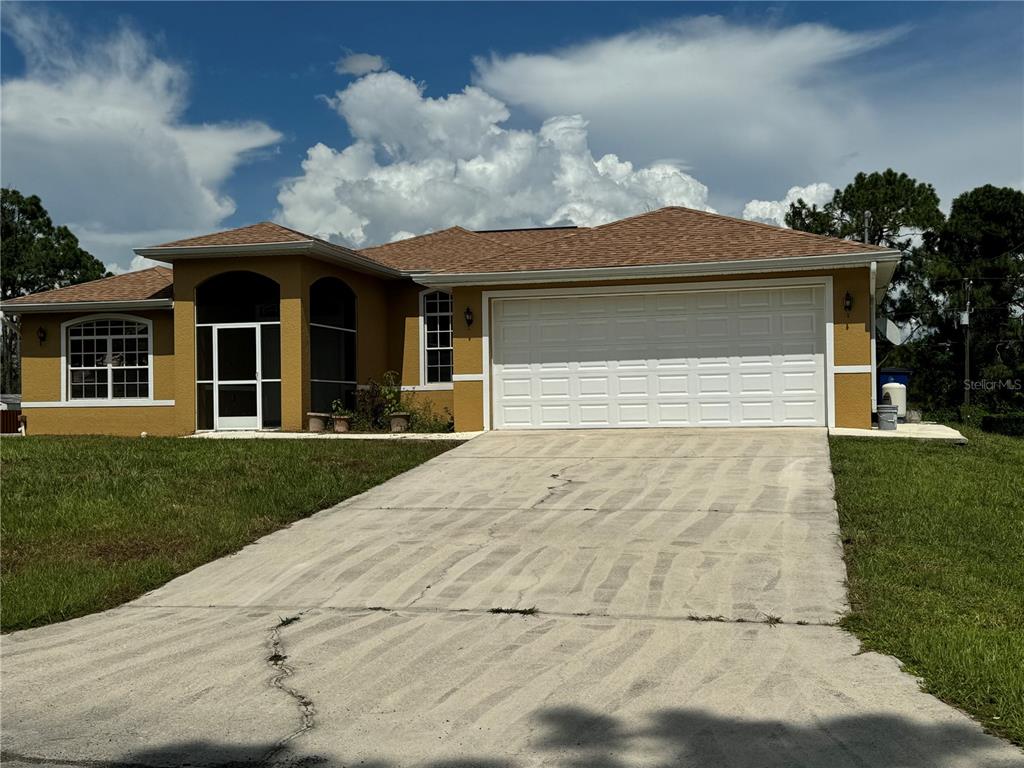 a front view of a house with garden