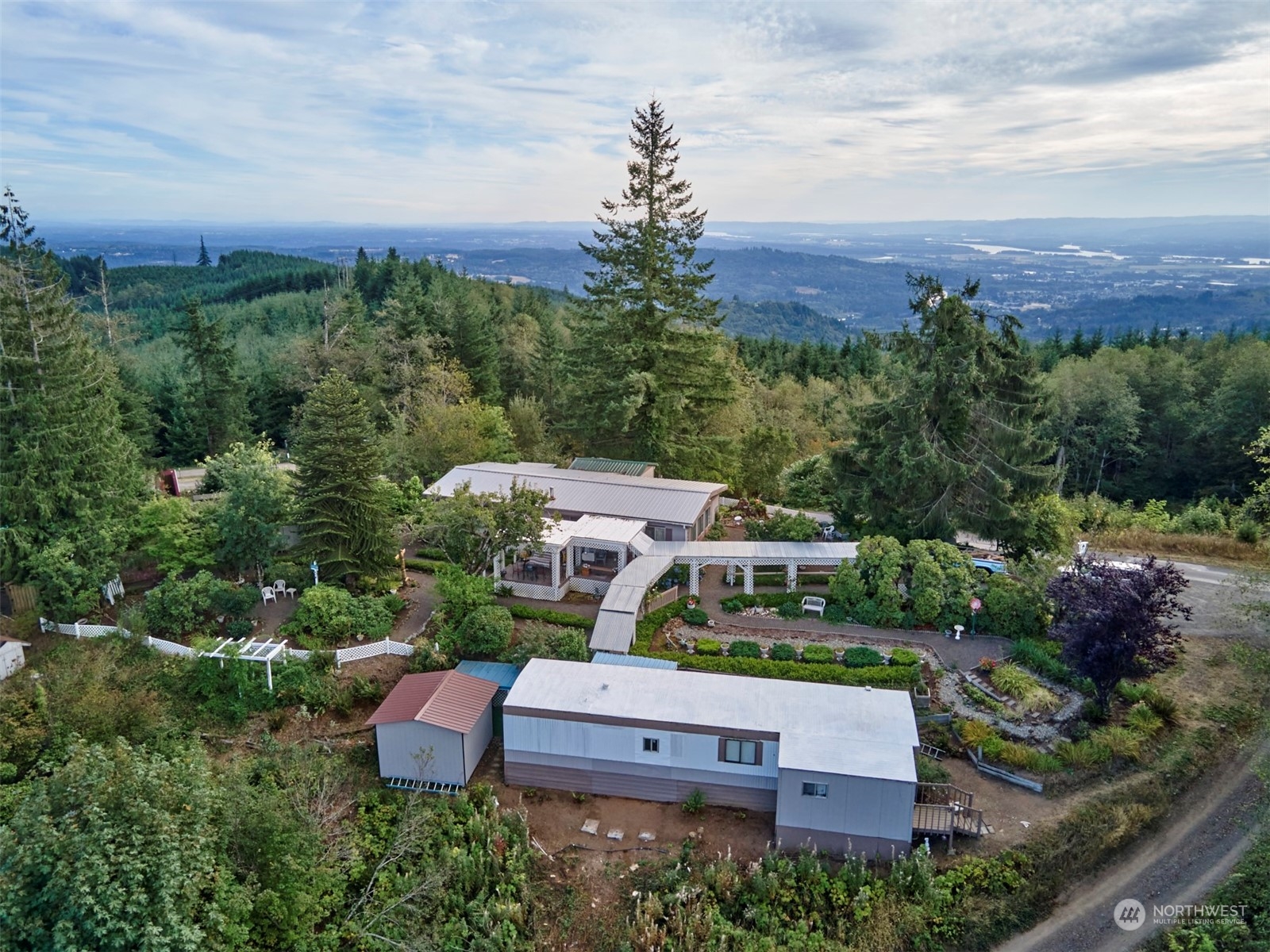 an aerial view of a house with a garden