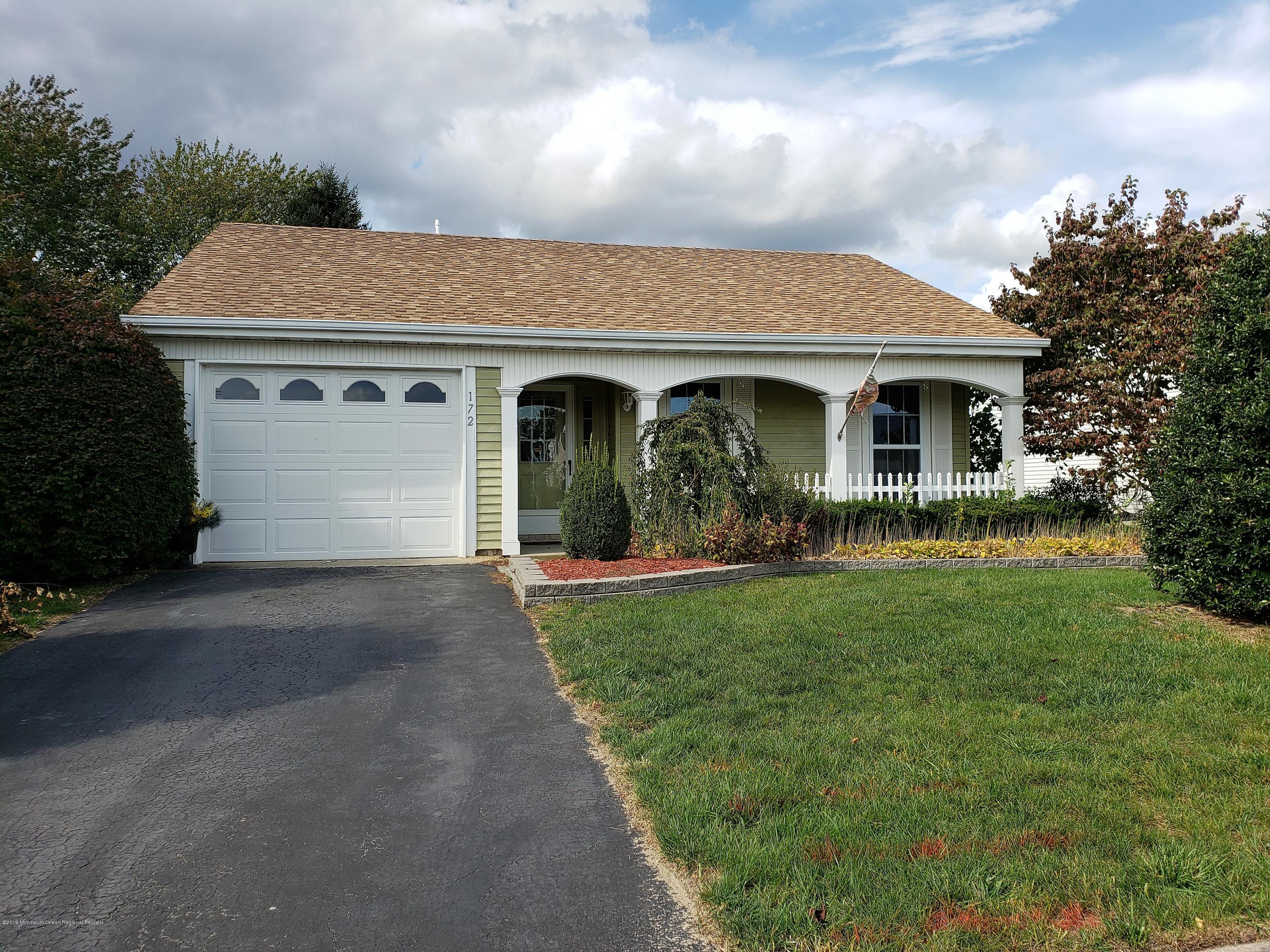 a view of house with yard