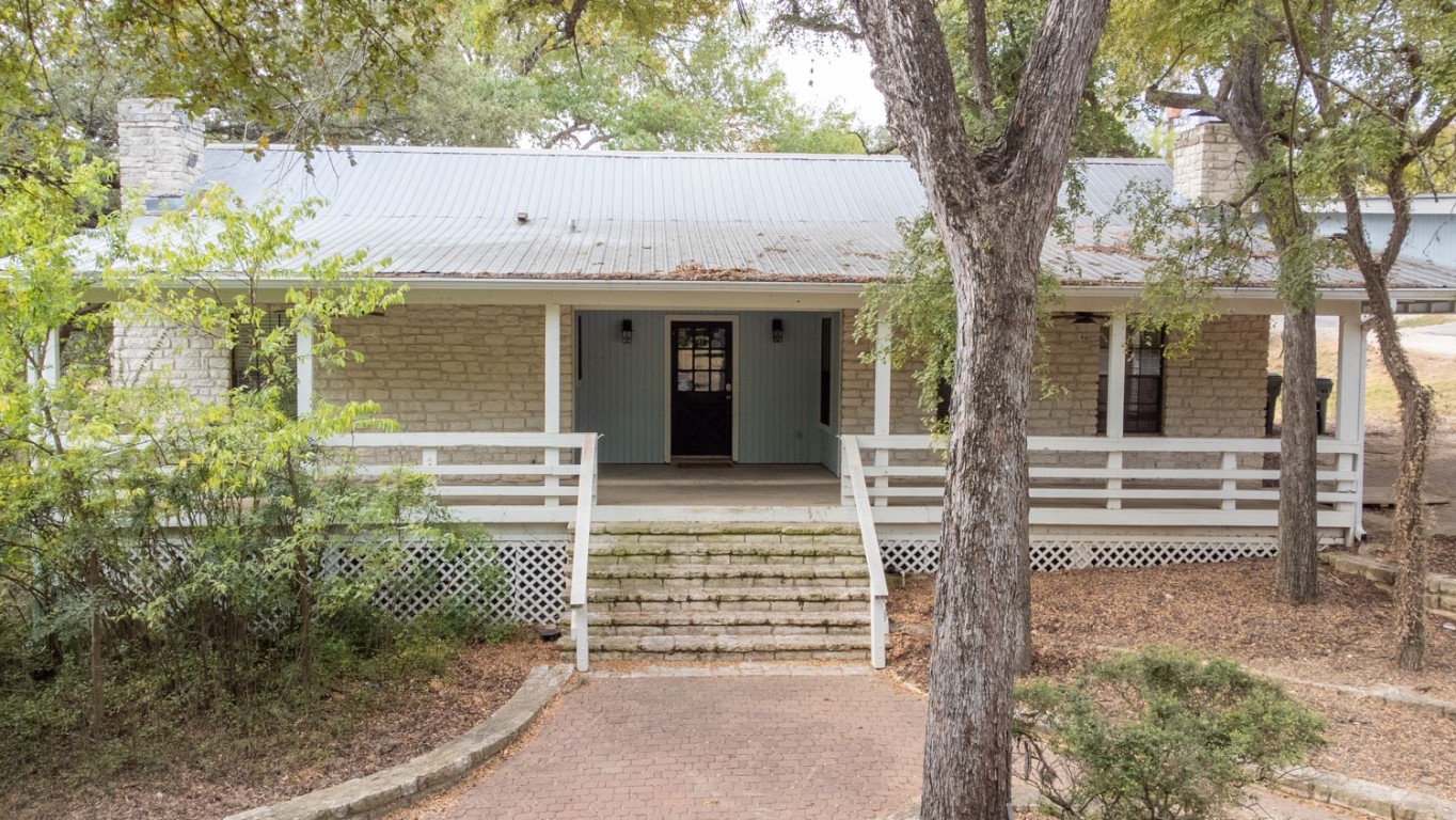 front view of a house with a tree