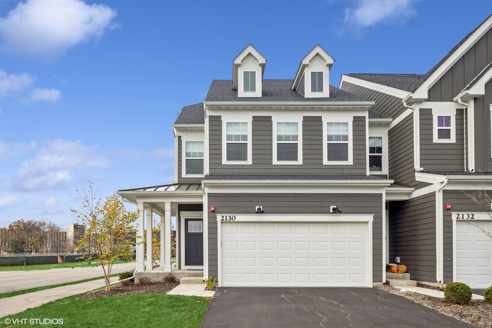 a front view of a house with a yard