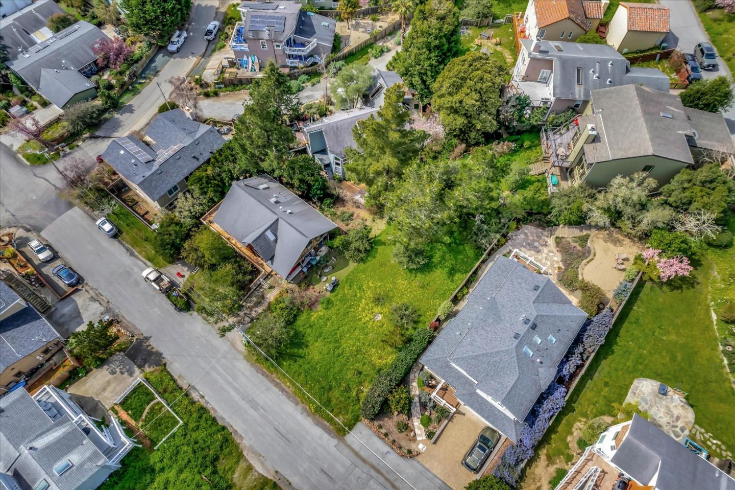 an aerial view of a house with a garden