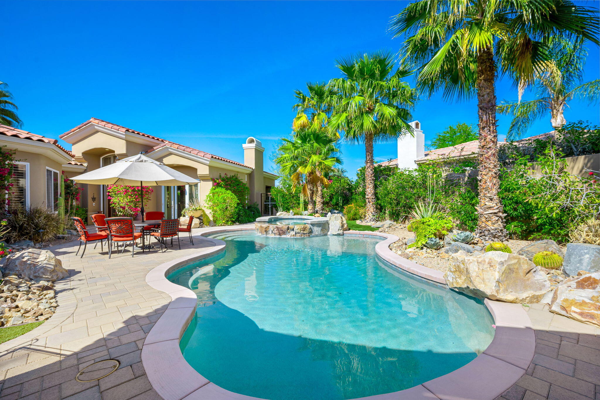 a view of a swimming pool with a patio