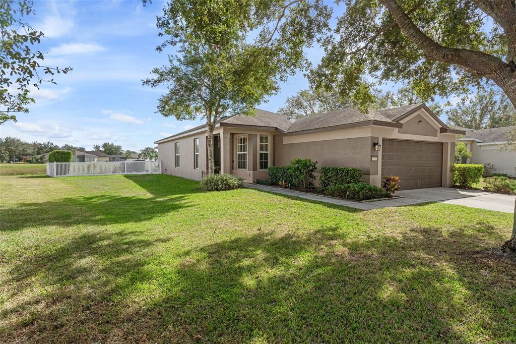 a front view of house with yard and green space