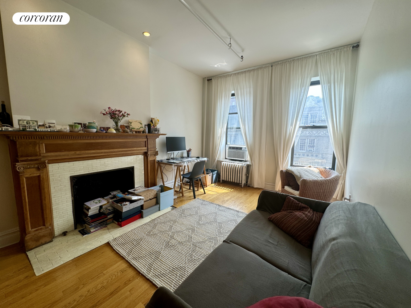 a living room with furniture and a fireplace