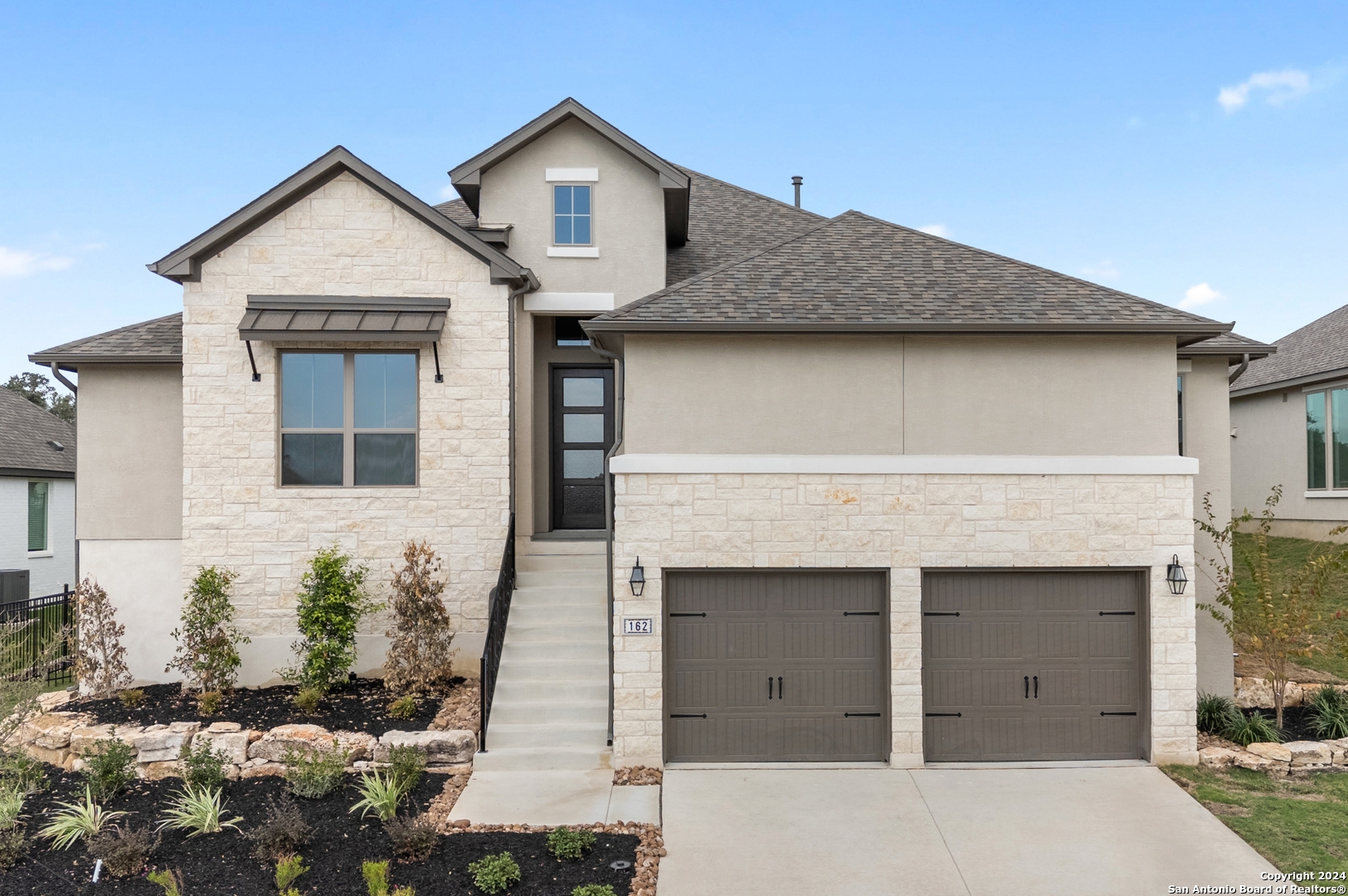 a front view of a house with a yard