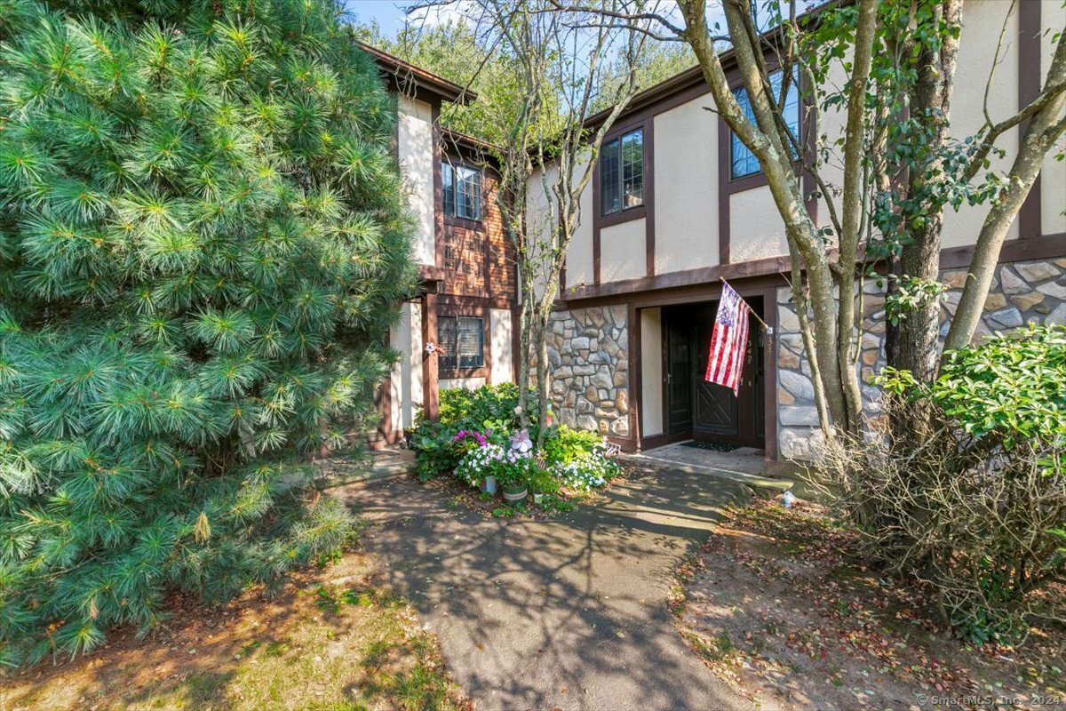 front view of a house with a yard