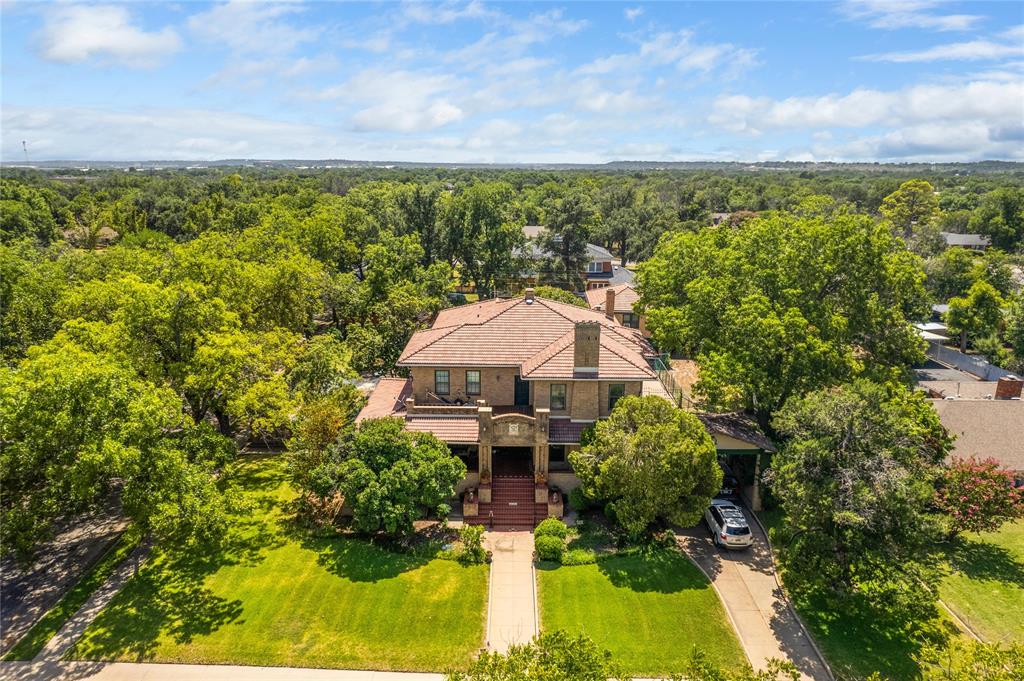 a aerial view of a house with a yard