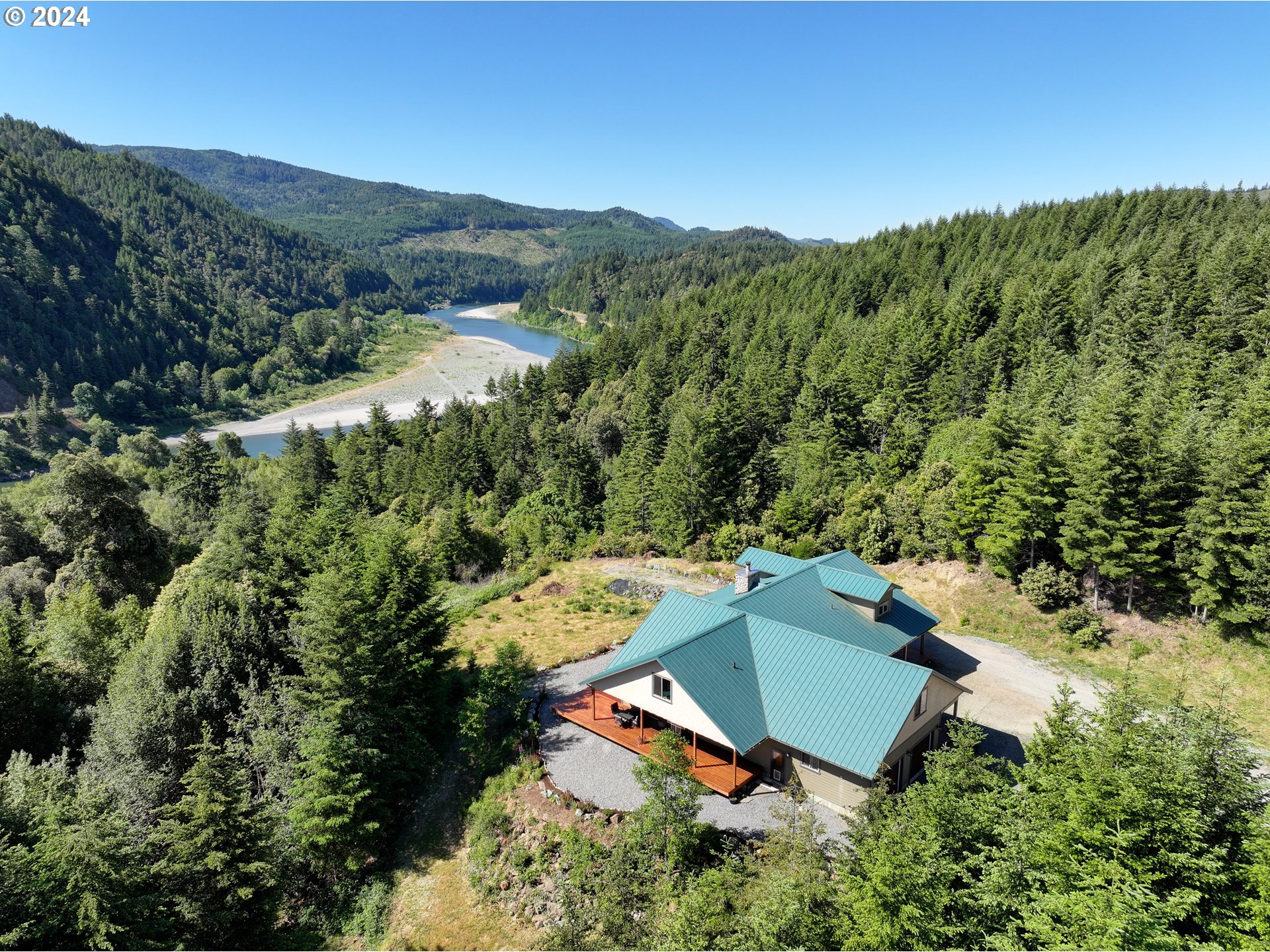 an aerial view of a house with mountain view