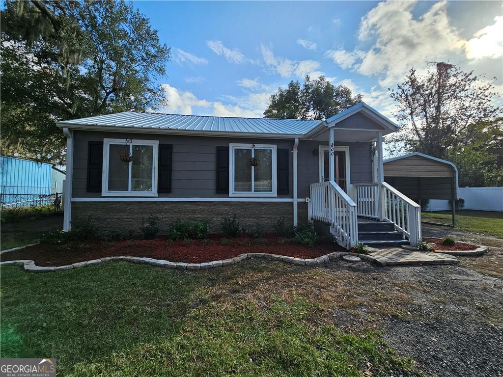 front view of a house with a yard