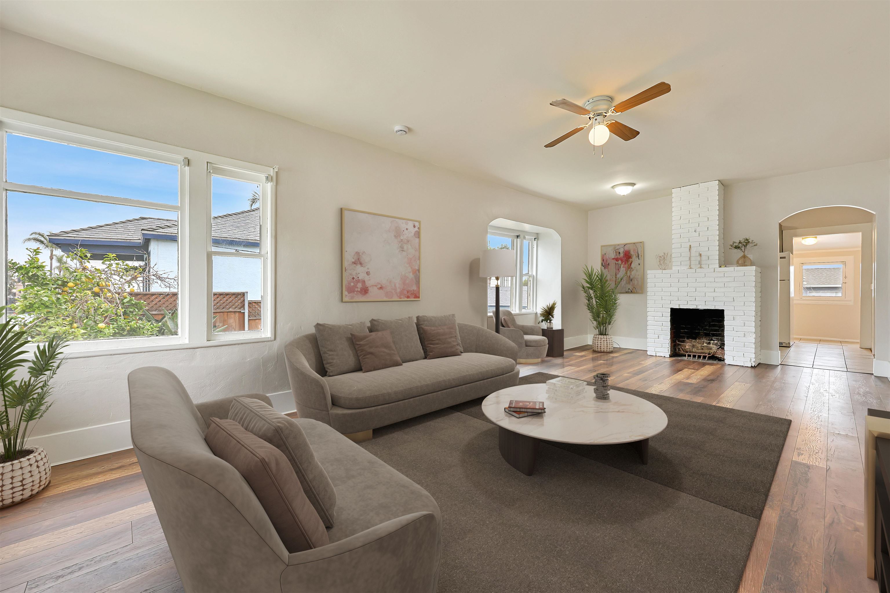 a living room with fireplace furniture and a table