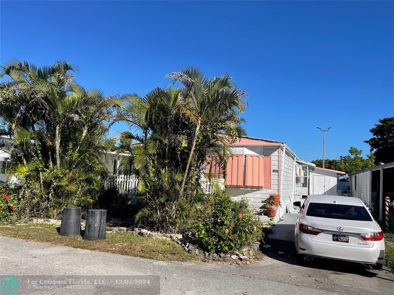 a car parked in front of a house