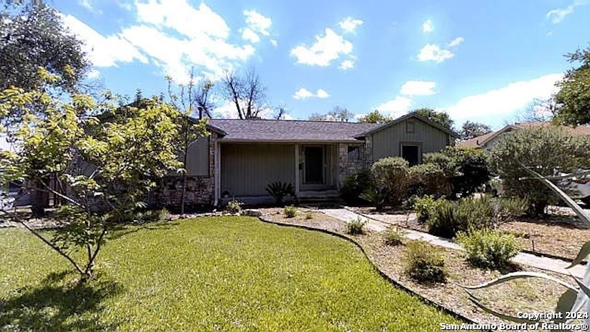 a view of a house with swimming pool and sitting area