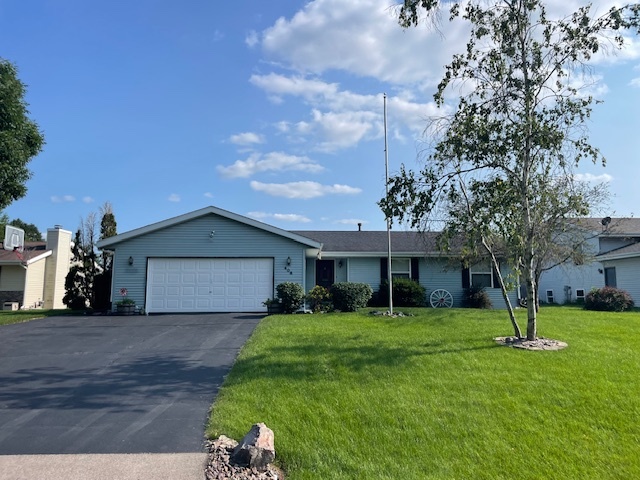 a view of a yard in front of a house