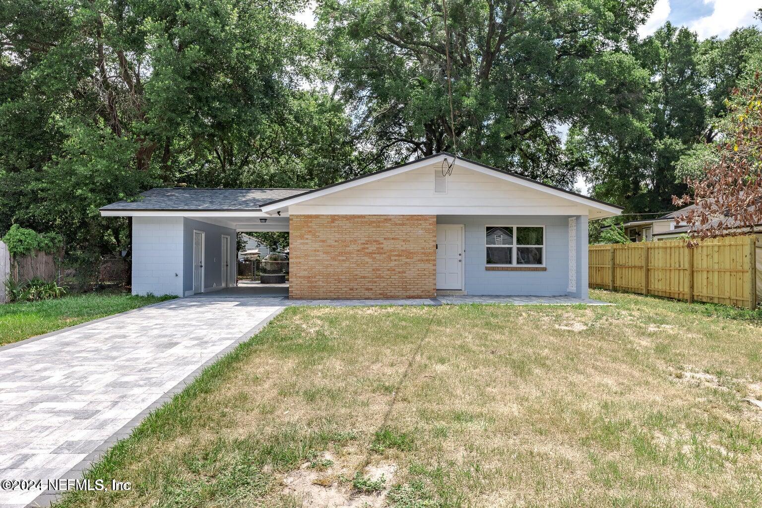 a house with a tree in front of it