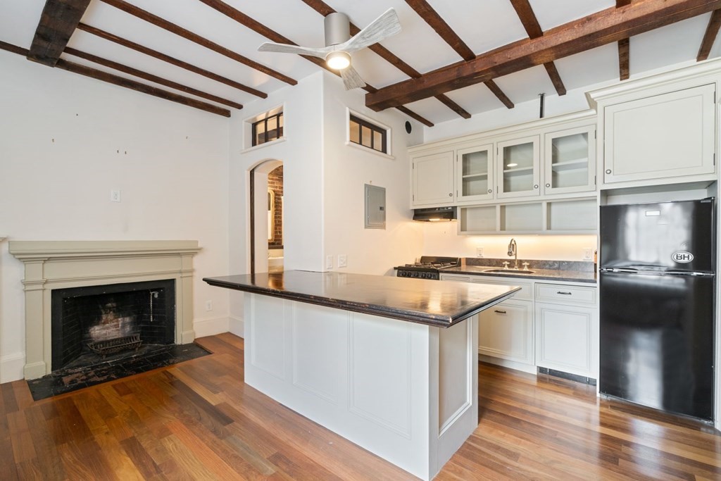 a kitchen with stainless steel appliances granite countertop a stove and a refrigerator