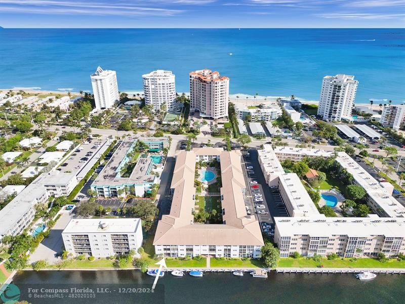 First floor corner unit w/ waterfront view & private beach access