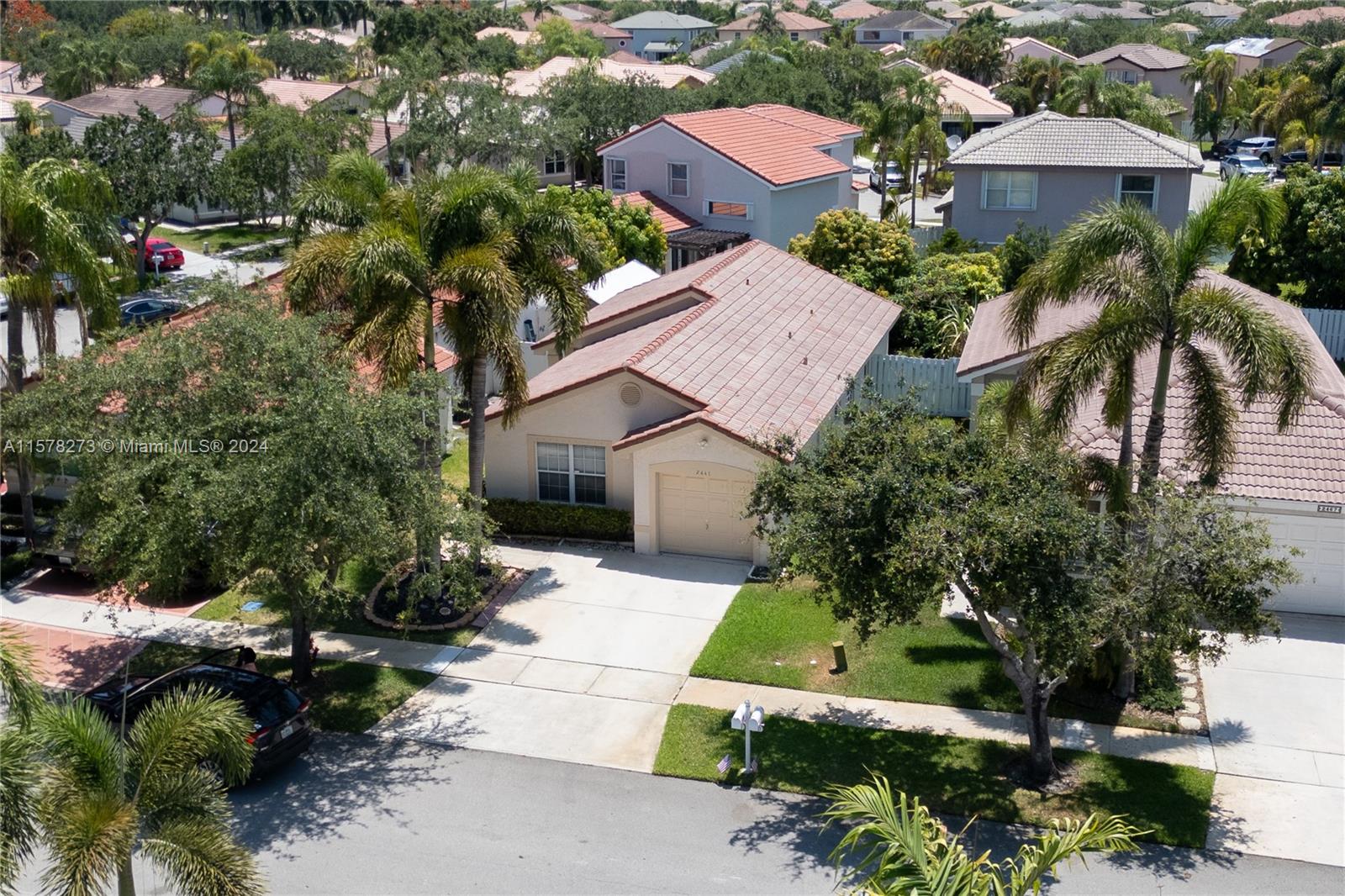 an aerial view of a house with yard