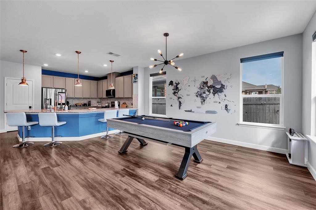 a living room with furniture kitchen view and a table