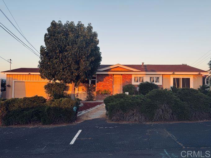 a view of a street in front of a house