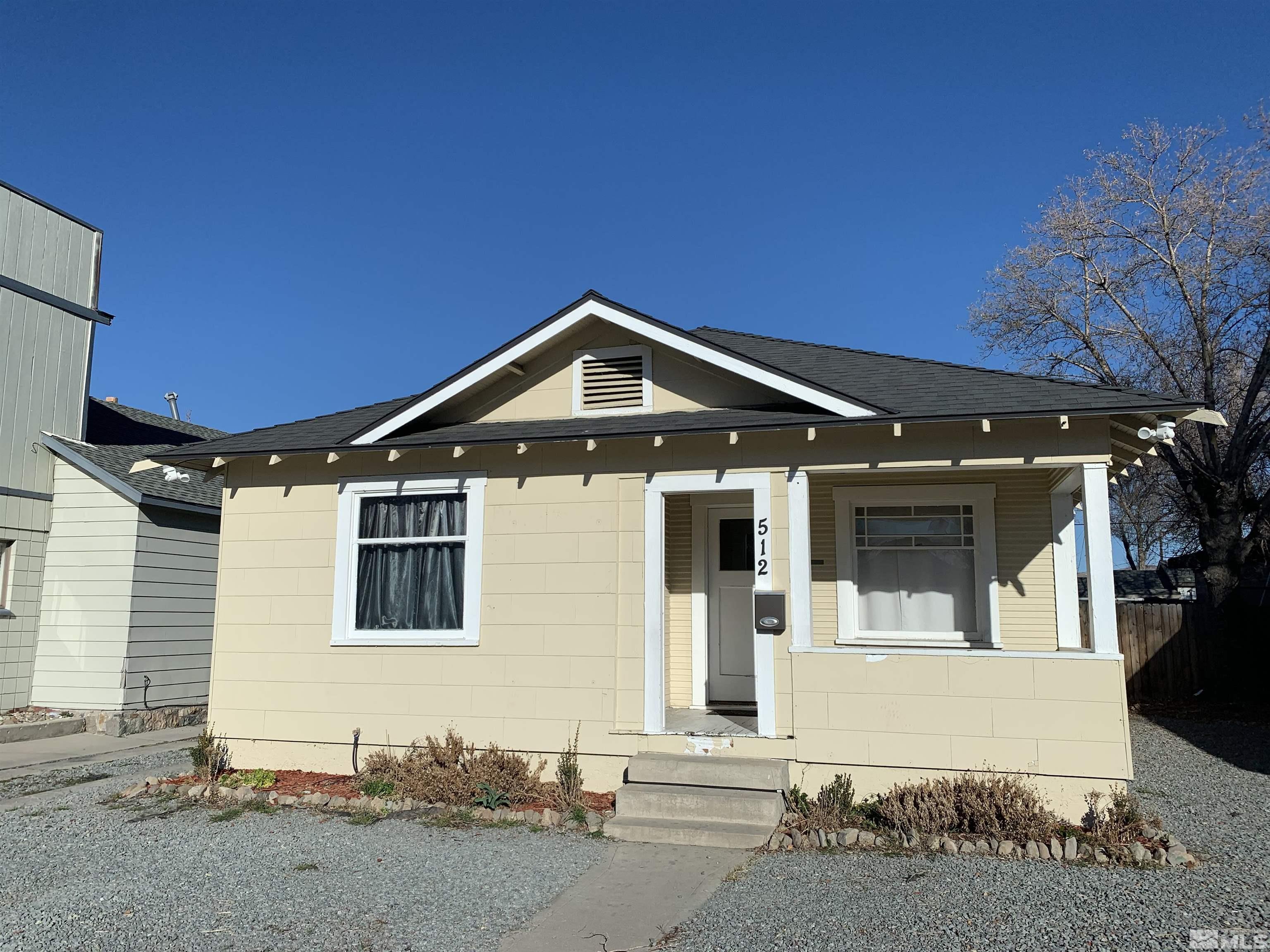 a front view of a house with a garage