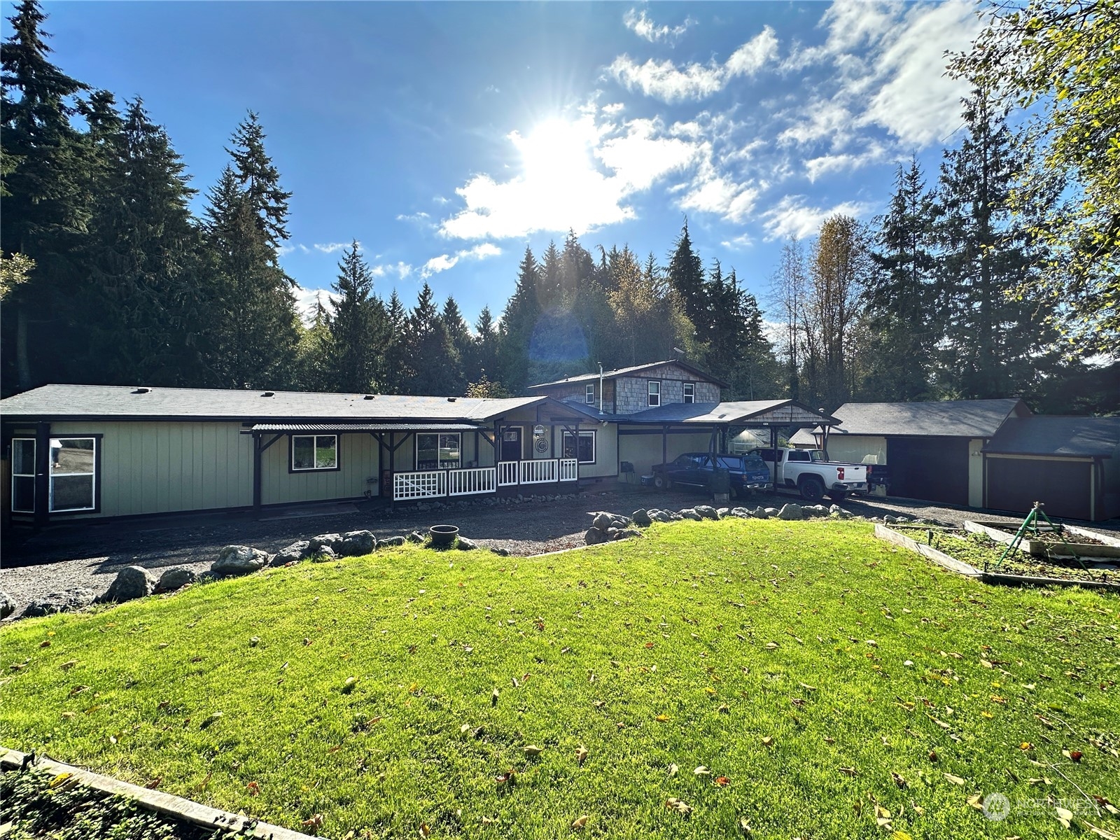 a view of a house with swimming pool and yard with green space