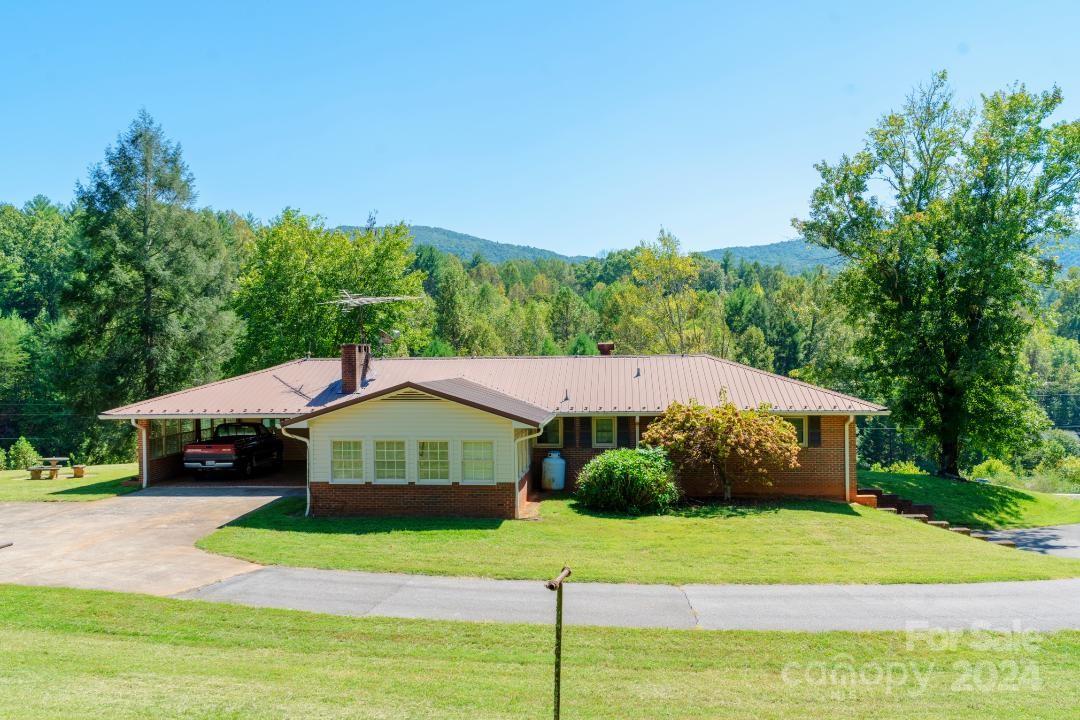 a house with trees in the background