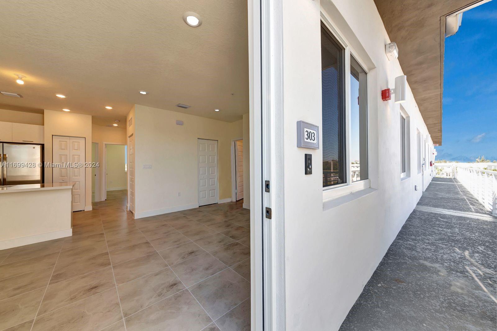 a view of a hallway with windows