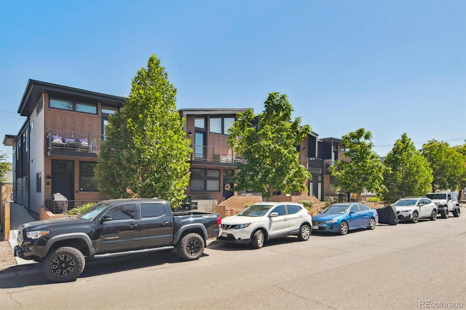 a view of a cars parked in front of a house