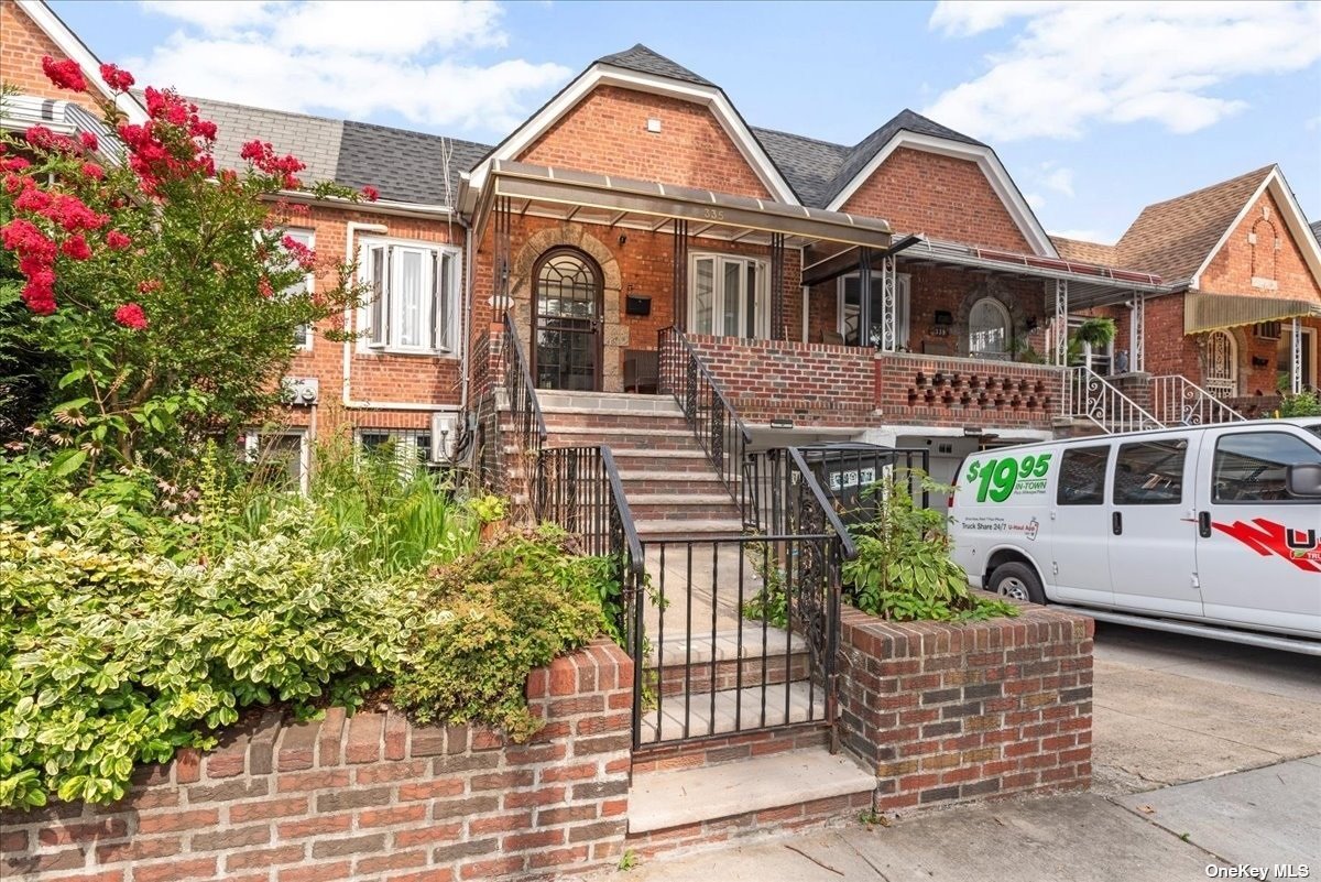 a front view of a house with garden