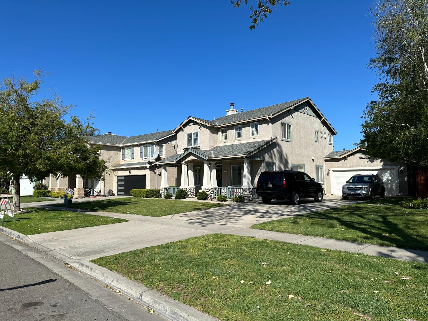 a view of house with yard and green space